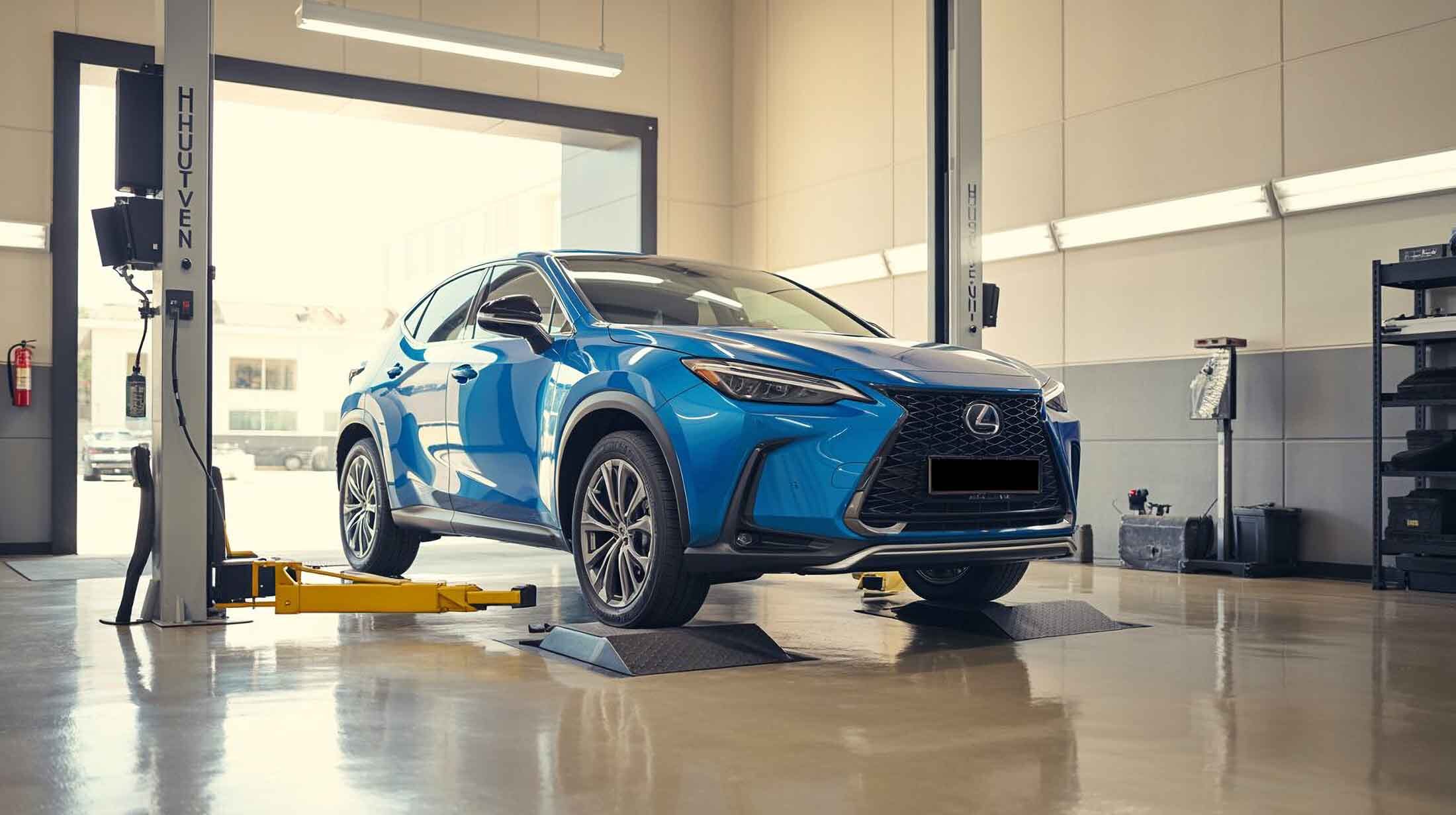 Blue Lexus SUV in shop ready to go on lift – auto body repair pawcatuck – Browns Collision Center Blue Lexus SUV in shop ready to go on lift - auto body repair pawcatuck - Browns Collision Center