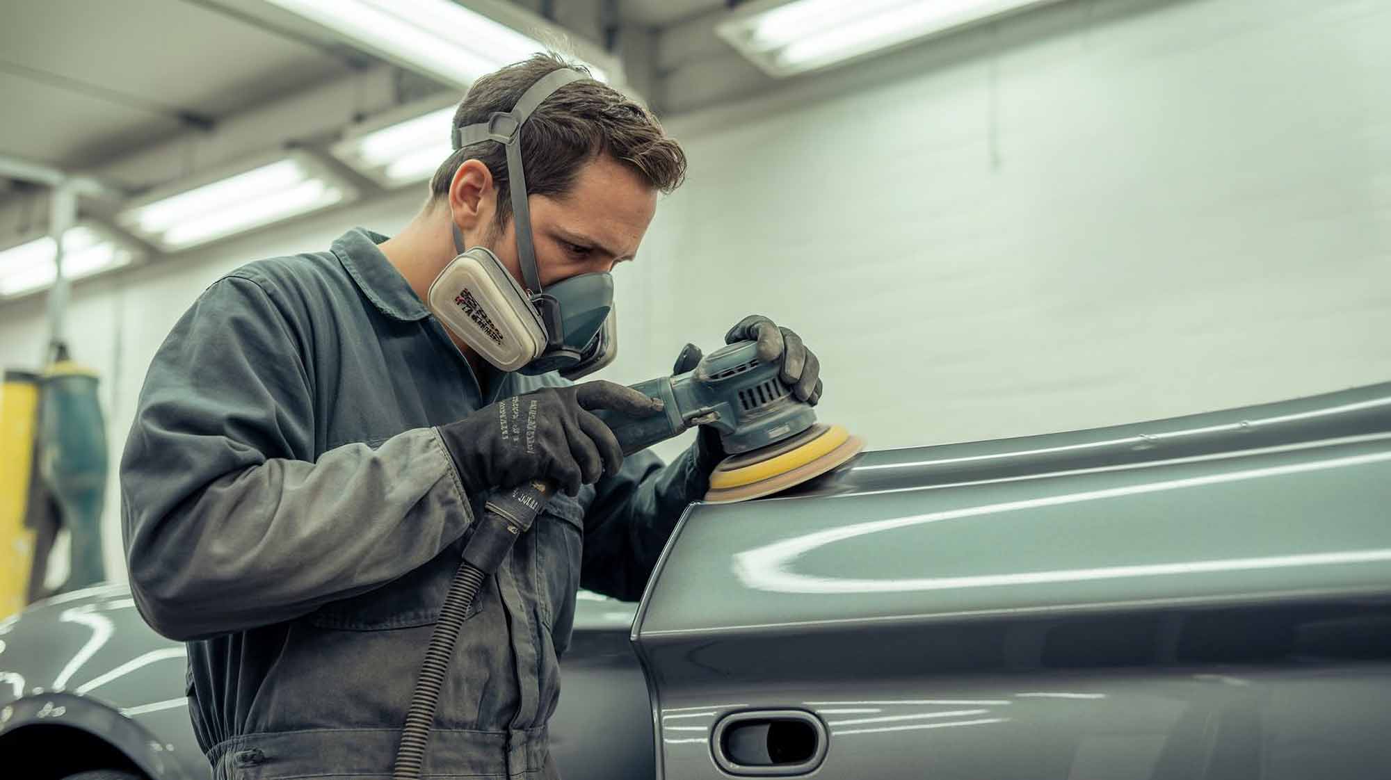 technician using orbital sander on vehicle for repair – auto body repair pawcatuck – browns collision center technician using orbital sander on vehicle for repair - auto body repair pawcatuck - browns collision center