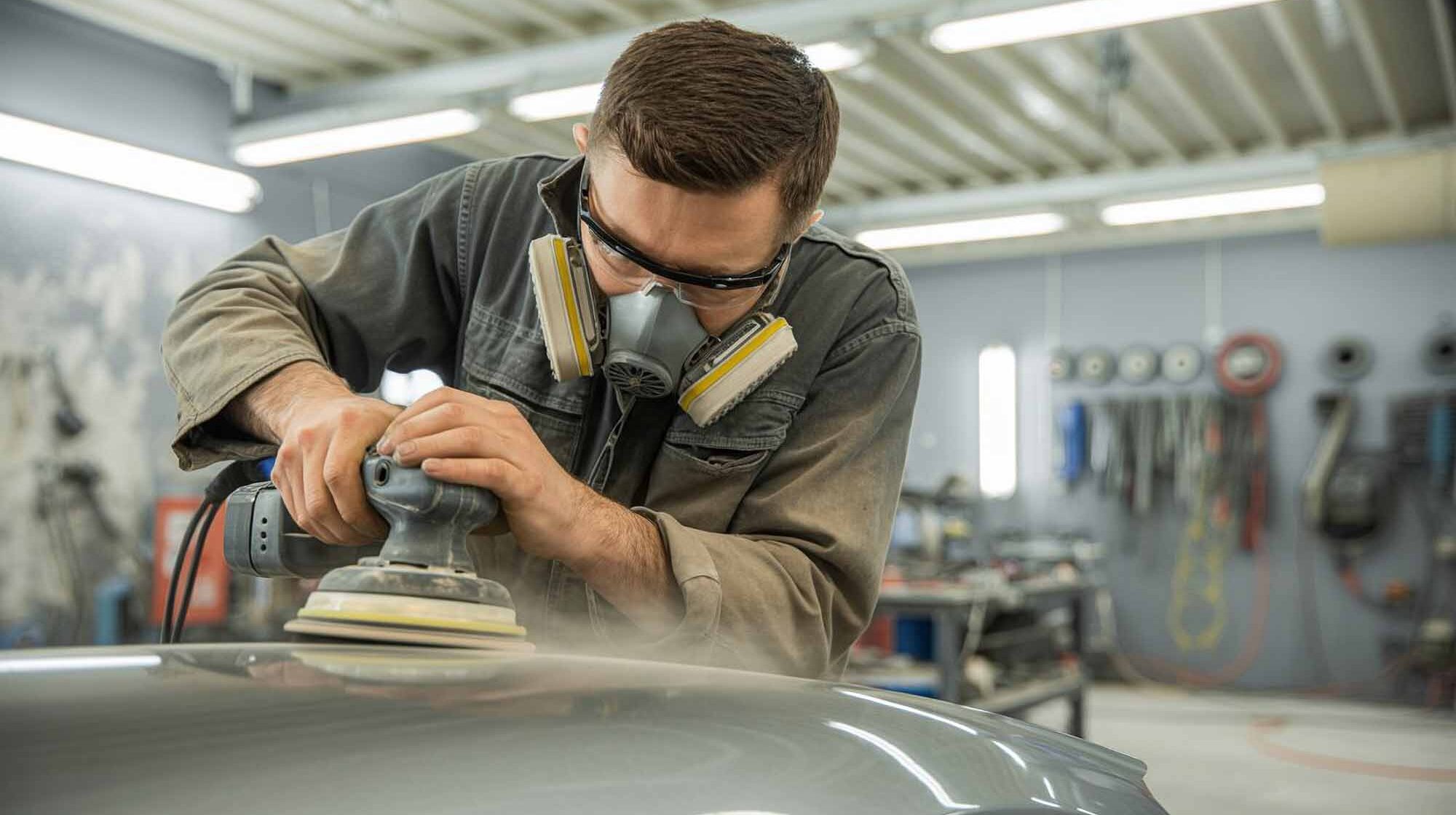 technician with respirator on sanding hood of vehicle – auto body repair pawcatuck – Browns collision center technician with respirator on sanding hood of vehicle - auto body repair pawcatuck - Browns collision center
