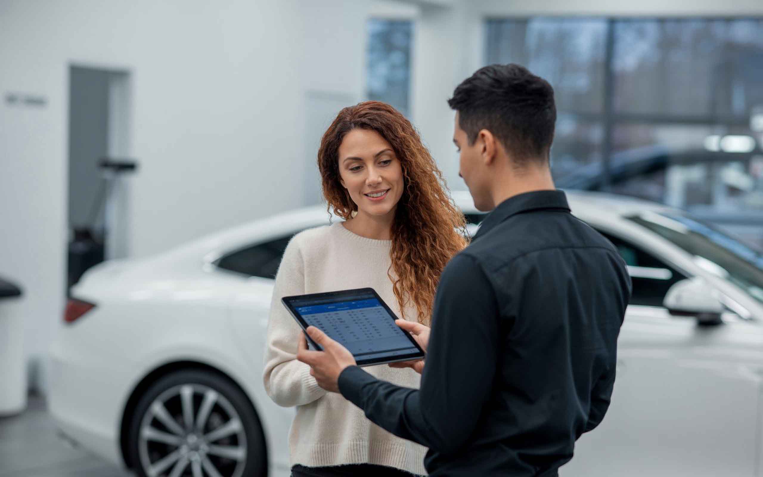 Technician on table talking to customer about collision repair services - auto body shop pawcatuck - browns collision center